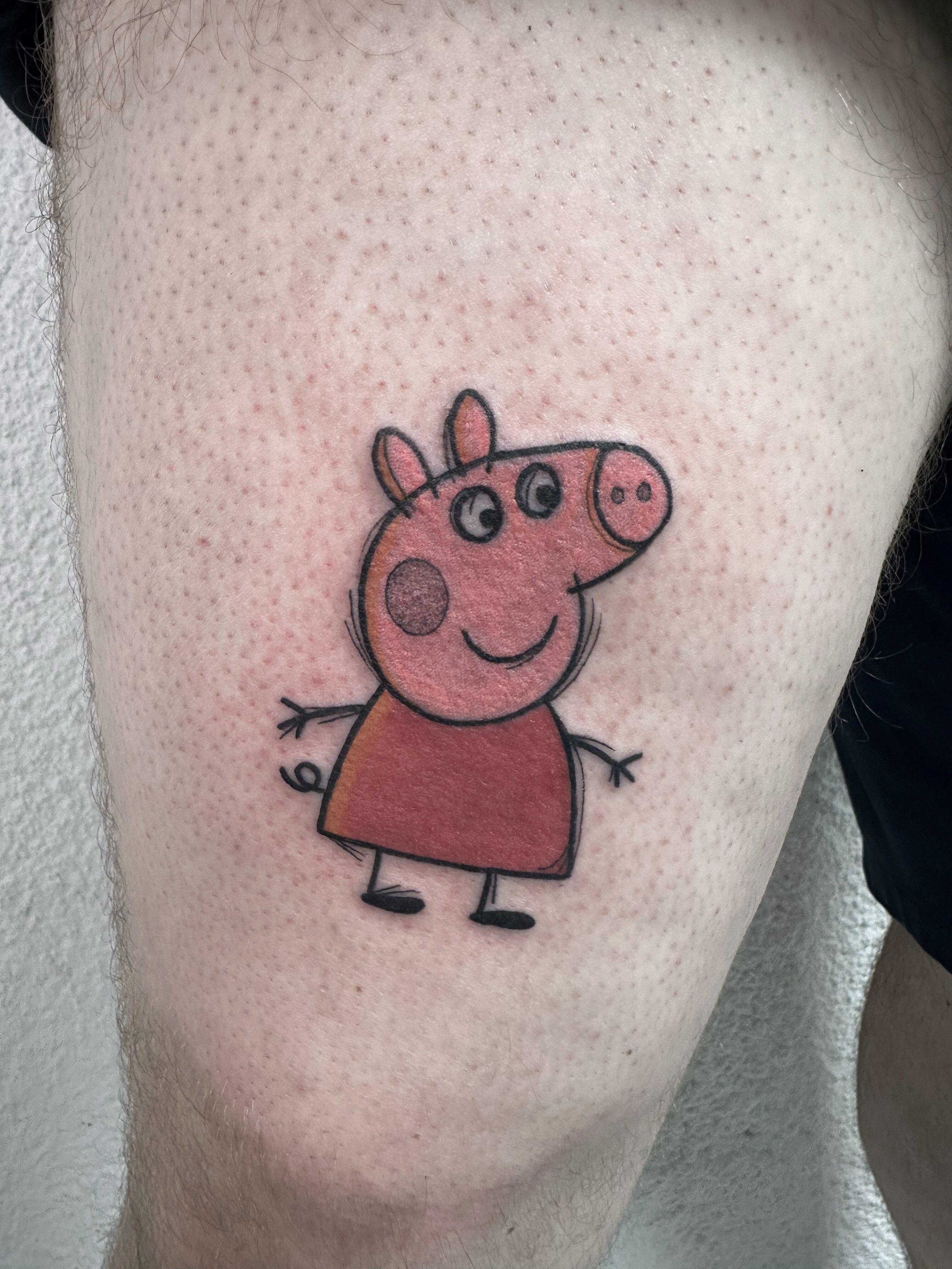 cute cartoon peppa pig tattoo with bold outlines and color fill